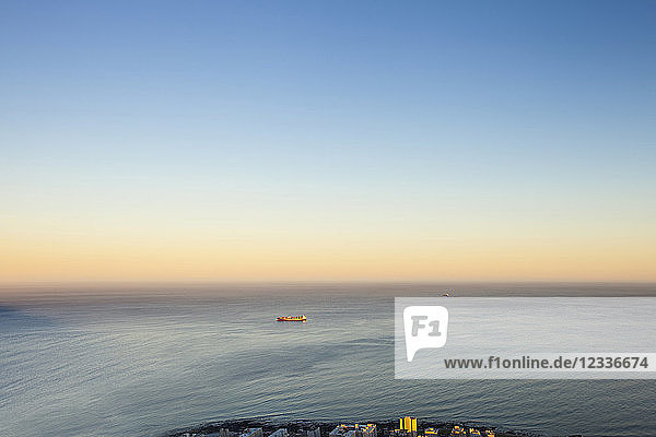 Africa  South Africa  Cape Town  Atlantic Ocean  container ship in the evening light