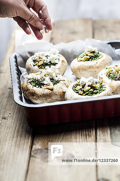 Filled champignons with spinach and feta in gratin dish