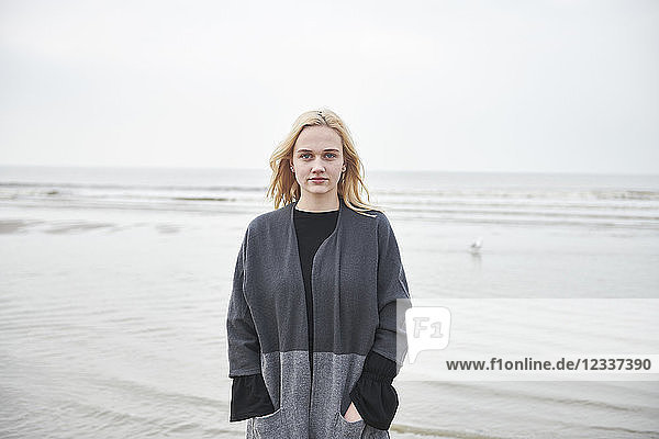 Netherlands  portrait of blond young woman on the beach