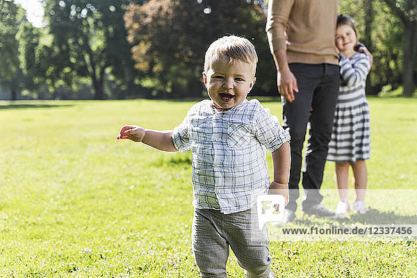 Happy boy with family in a park