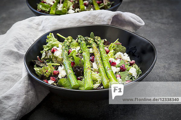 Mixed salad with fried green asparagus  feta and pomegranate seeds