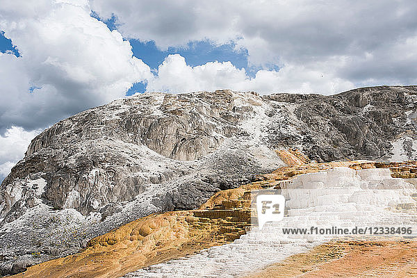White mineral terraces on mountainside  Yellowstone National Park  Wyoming  USA
