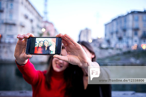 Young women taking selfie  Milan  Lombardy  Italy