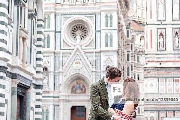 Young couple hugging  Santa Maria del Fiore  Florence  Toscana  Italy