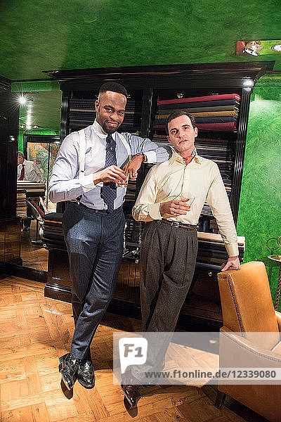 Two stylish tailors in tailors shop  portrait