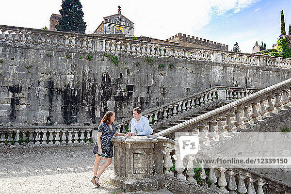 Young couple relaxing by San Miniato al Monte Church  Florence  Toscana  Italy