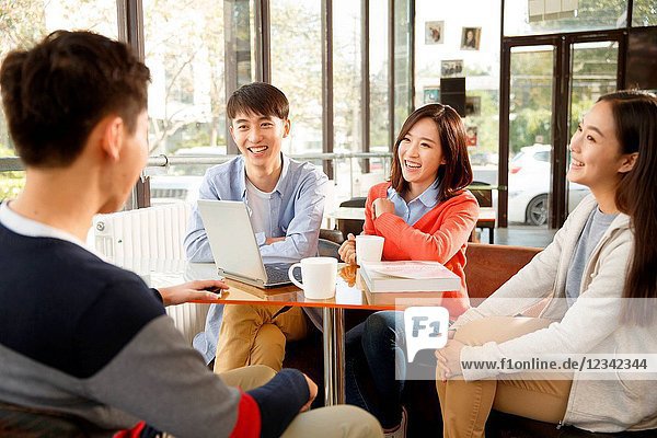 Young men and women in the coffee shop