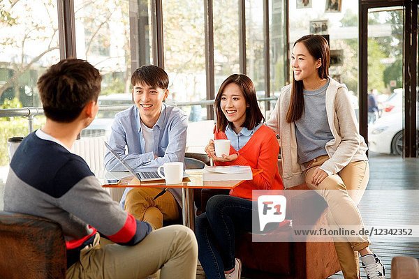 Young men and women in the coffee shop