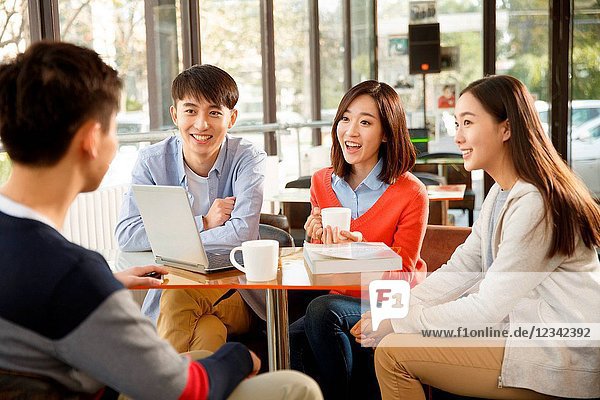 Young men and women in the coffee shop