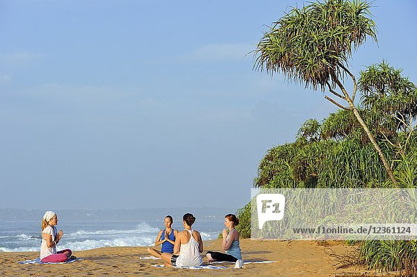 Yoga class on the beach by Sen Wellness Sanctuary  near Tangalle  South Coast of Sri Lanka  Indian subcontinent  South Asia.