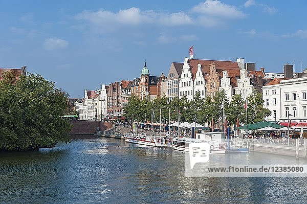 Historic houses  excursion boats on the river Trave  Lübeck  Schleswig-Holstein  Germany  Europe