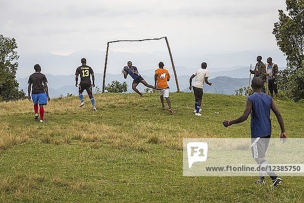 Teenagers at football match  Bwindi Impenetrable National Park  Uganda  Africa
