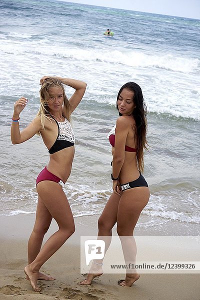 Two women on beach  wearing bikini  feeling sexy. Greece  Crete  Malia