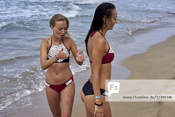 Two women at beach  wearing bikini. Greece  Crete  Malia