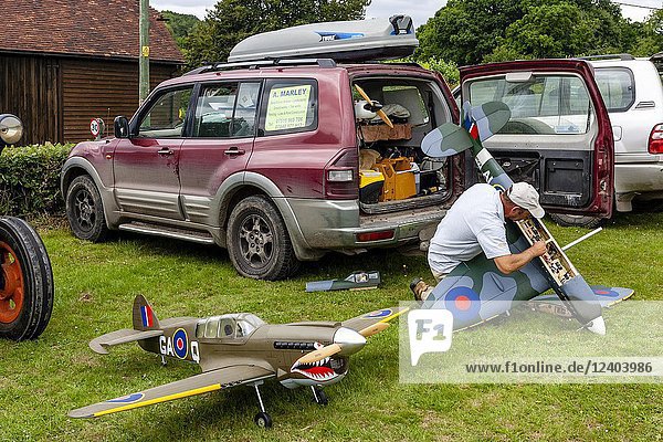 A Man Assembles A Model Airplane  High Hurstwood Village Fete  Sussex  UK.