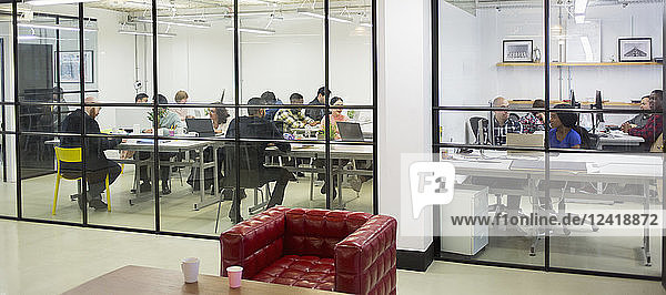 Business people working in conference room and office