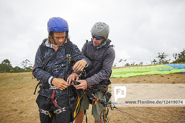 Paragliders preparing equipment