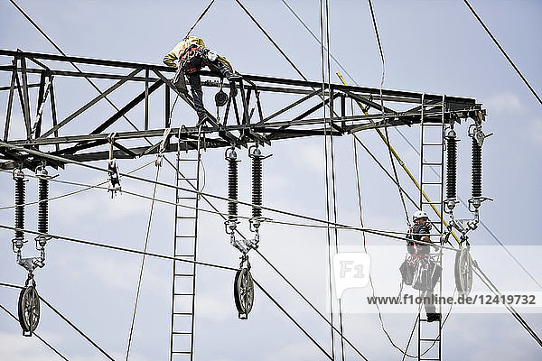 Installer during installation of high-voltage power line