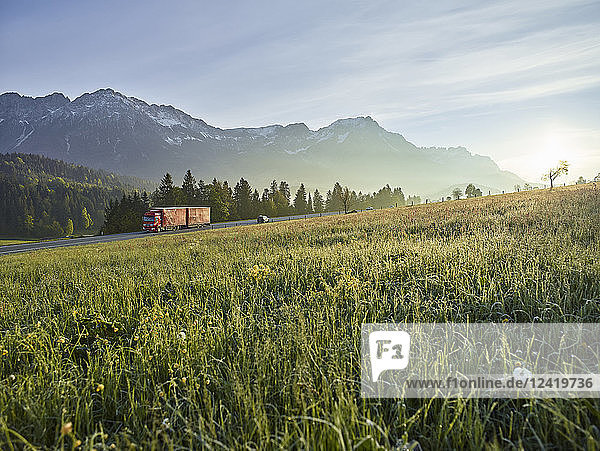 Austria  Tyrol  truck on country road in the morning light