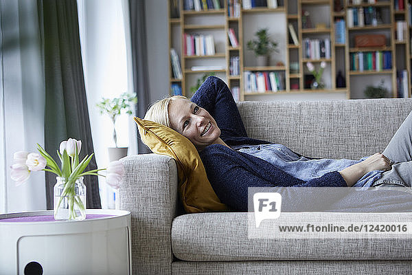 Woman relaxing at home  lying on couch