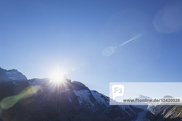 Austria Carinthia sundown last sunbeams of the day at Grossglockner peak on right Pasterze glacier and Johannisberg High Tauern National Park