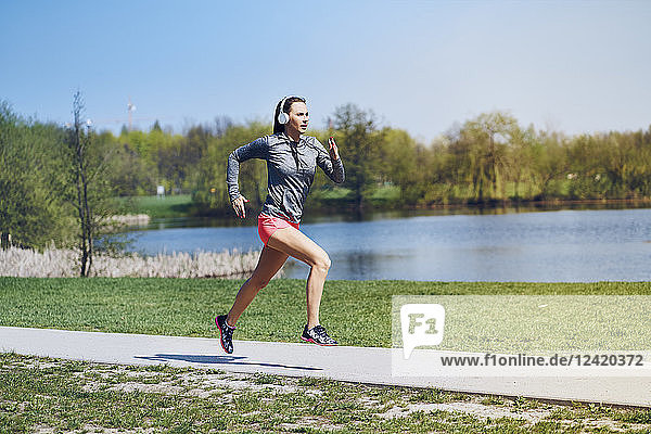 Female jogger running at park