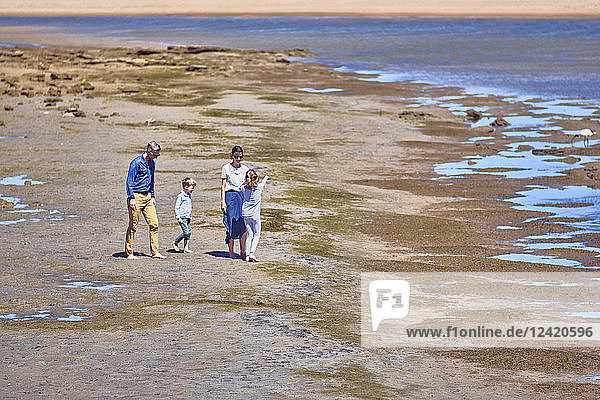 Australia  Adelaide  Onkaparinga River  family walking on the beach together
