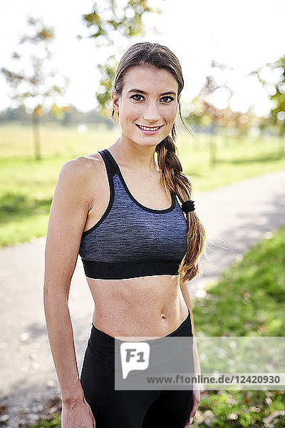 Portrait of smiling sportive young woman