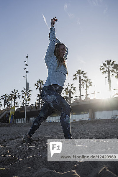 Woman during workout on the beach