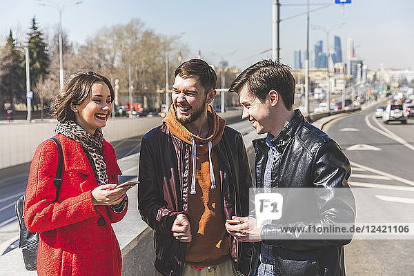 Russia  Moscow  group of friends talking next to a road