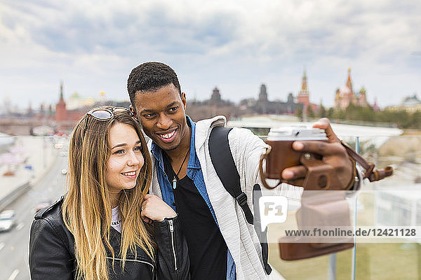 Russia  Moscow  couple taking a selfie and smiling