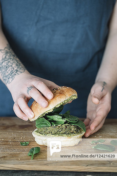 Woman preparing vegan burger