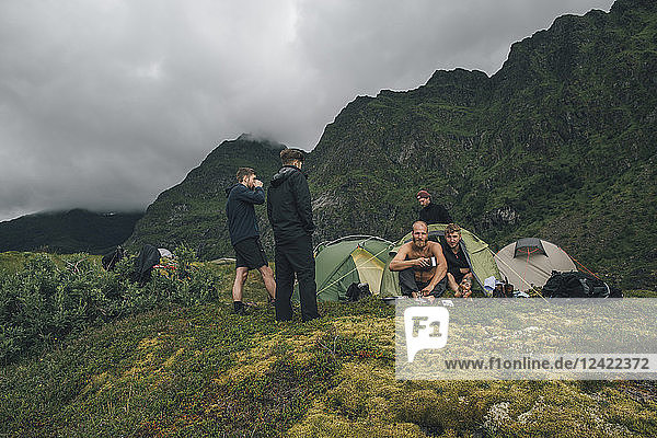 Norway  Lofoten  Moskenesoy  Young men camping in the mountains