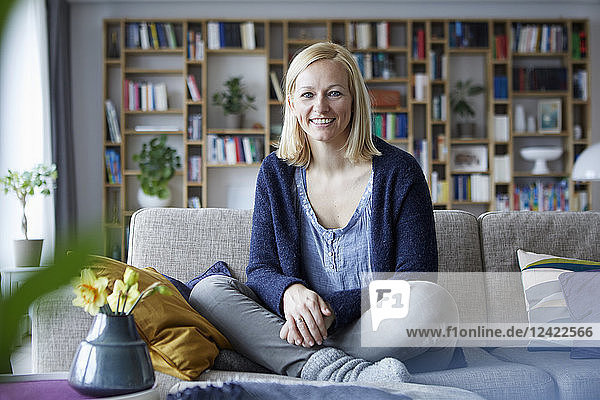 Woman relaxing at home  sitting on couch