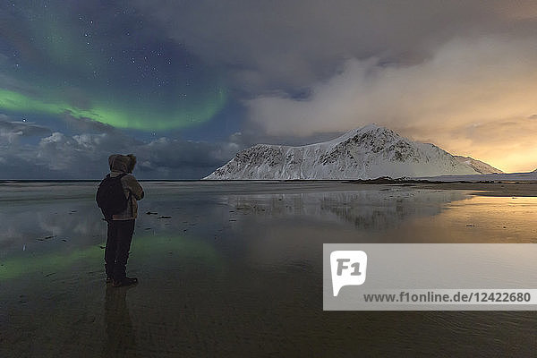 Norway  Lofoten  Vareid  Flakstad  man watching sunset and northern lights