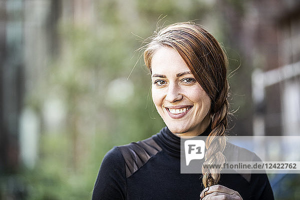 Portrait of smiling woman with braid