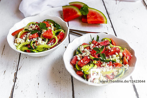 Two bowls of salad with watermelon  cucumber  feta and mint