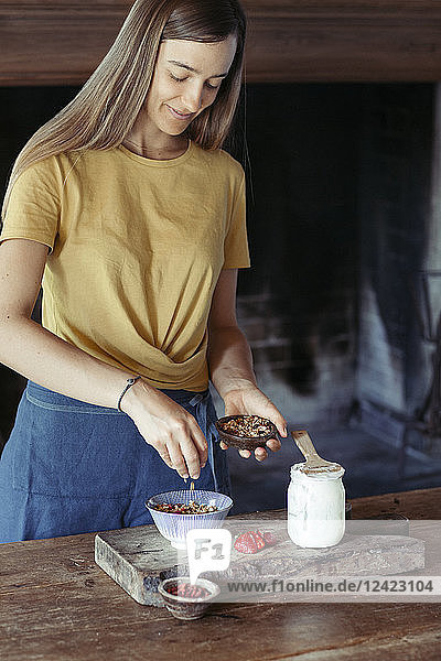 Woman preparing muesli