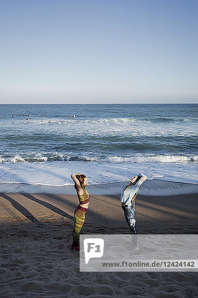 Women during workout on the beach
