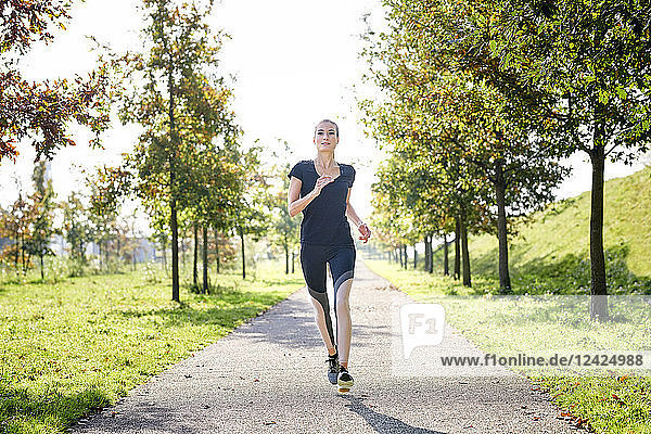 Young woman running in a park