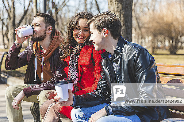 Russia  Moscow  group of friends at park having fun together  drinking coffee