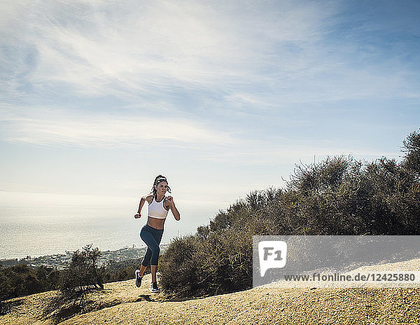 Woman jogging on mountain