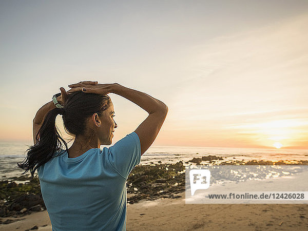 USA  California  Newport Beach  Woman exercising on beach