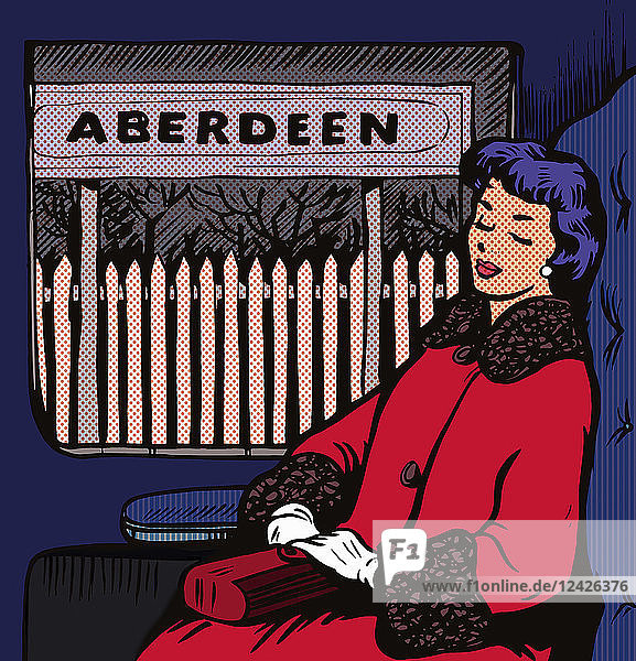Frau schläft im Zug auf dem Bahnhof Aberdeen ein