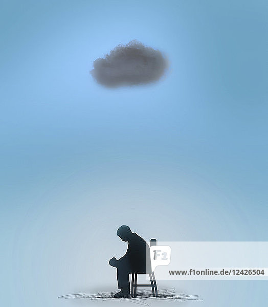 Man sitting under a black cloud