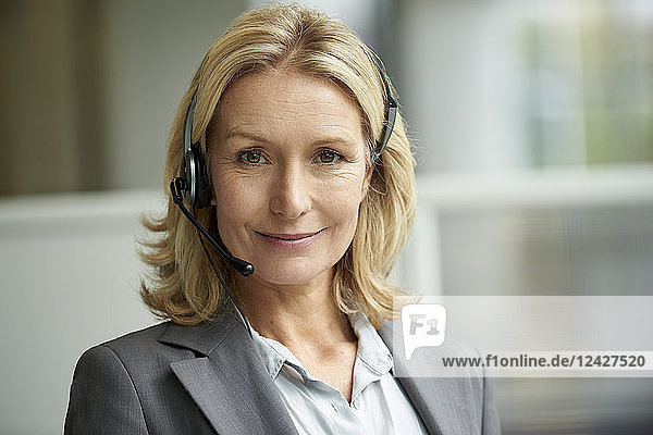 Close-up of telecaller with headset