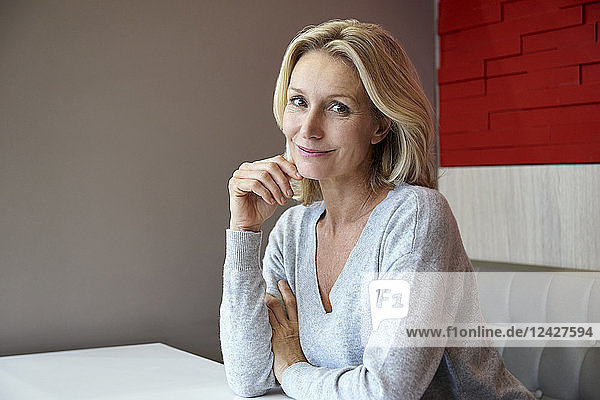 Smiling woman sitting in café