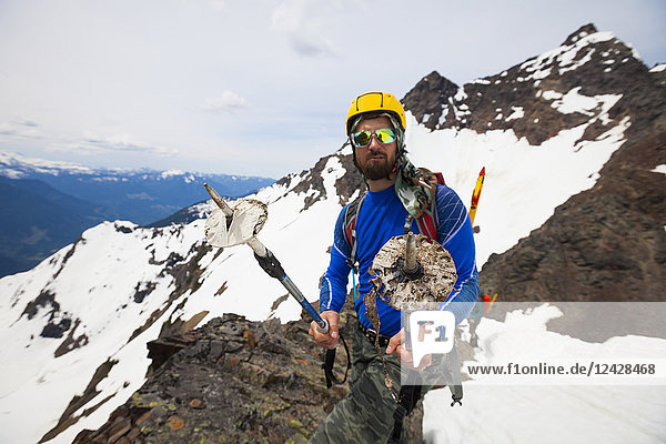 Portrait of mountain climber climbing Foley Peak  North Cascade Mountain Range  Chilliwack  British Columbia  Canada
