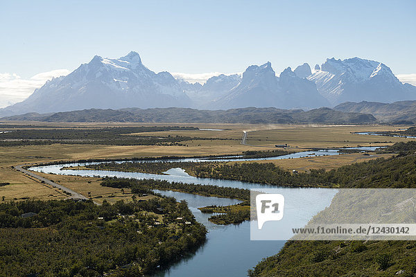 Majestic natural scenery with Rio Serrano river and mountain range in Torres del Paine National Park Magallanes Region Chile