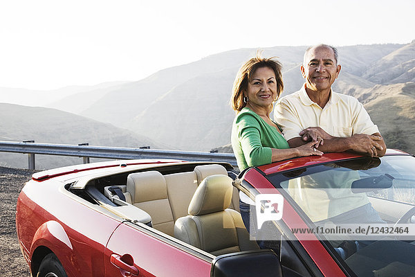 A hip senior Hispanic couple on a road trip in eastern Washington State  USA.